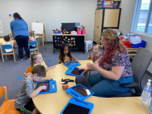 Students using iPads in a spoken language classroom